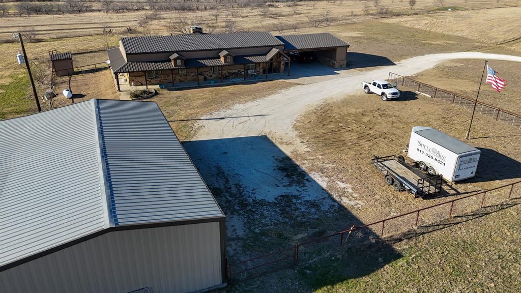 290 Barton Road Maypearl, TX 76064 - Photo 24 of 32 a terrace with wooden table and chairs