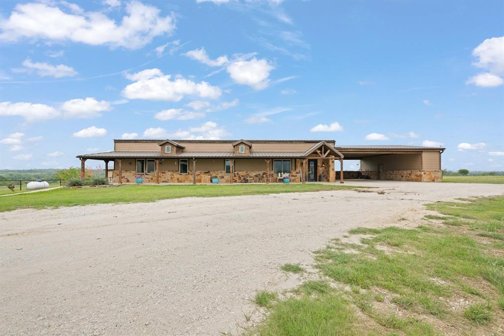 290 Barton Road Maypearl, TX 76064 - Photo 28 of 34 a front view of a house with a yard and garage