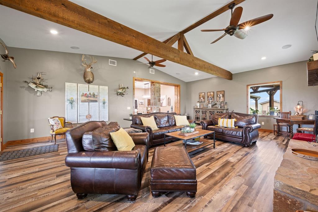 290 Barton Road Maypearl, TX 76064 - Photo 5 of 34 a living room with furniture a ceiling fan and a rug