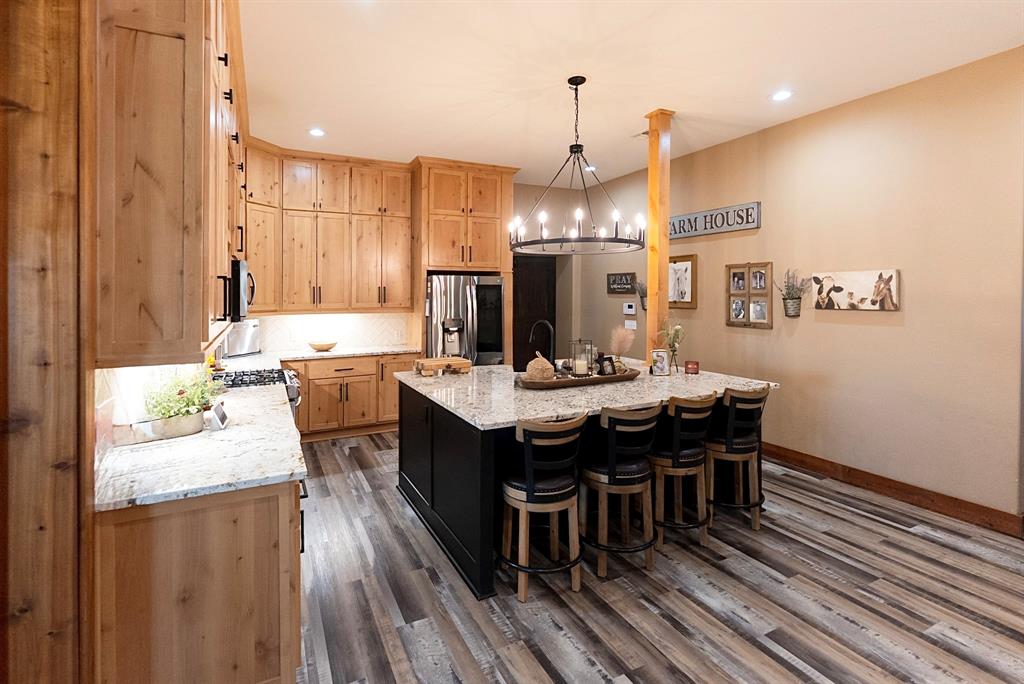 290 Barton Road Maypearl, TX 76064 - Photo 8 of 32 a large kitchen with a table and chairs