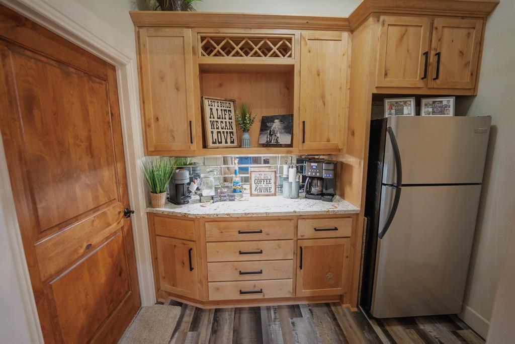 290 Barton Road Maypearl, TX 76064 - Photo 10 of 32 a bathroom with a sink a mirror and a shower