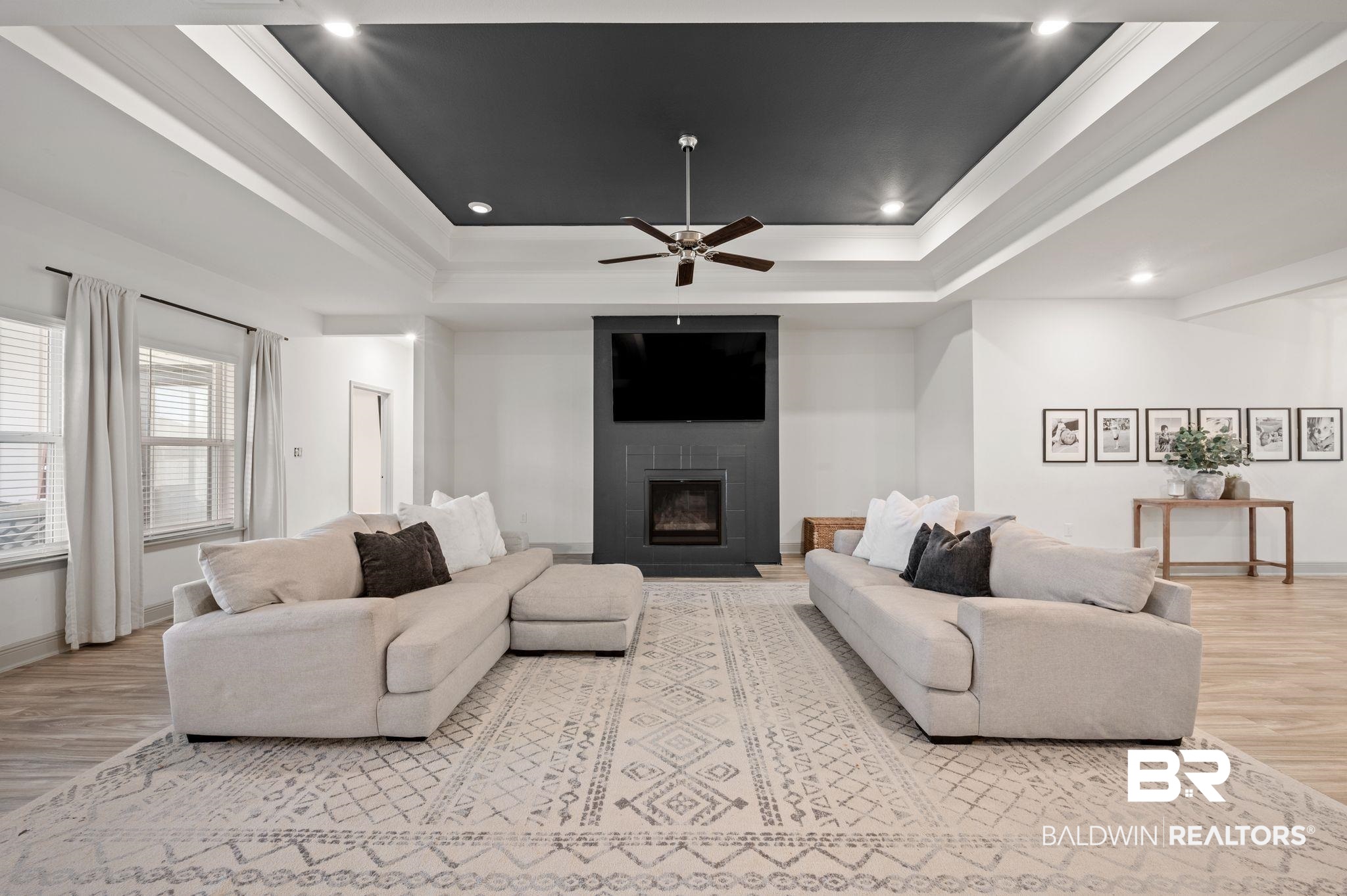 10169 Dunleith Loop Daphne, AL 36526 - Photo 6 of 40 Living area featuring a tray ceiling, wood finished floors, ceiling fan, recessed lighting, and ornamental molding