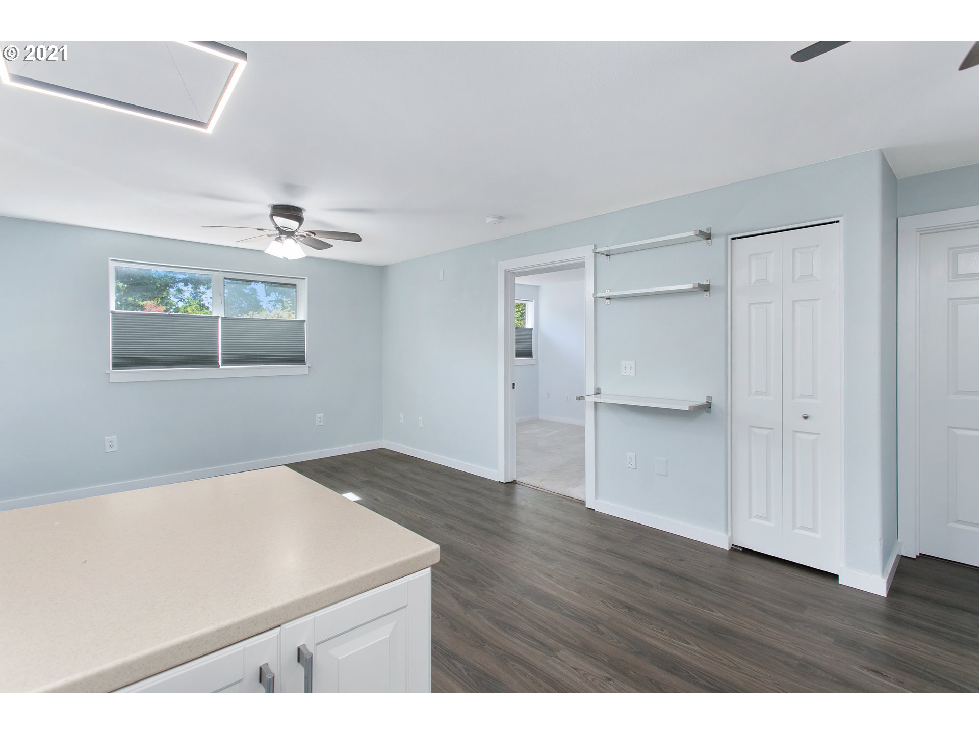 10345 Northeast Clackamas Street, Unit 2 Portland, OR 97220 - Photo 14 of 28 a view of an empty room with a chandelier fan