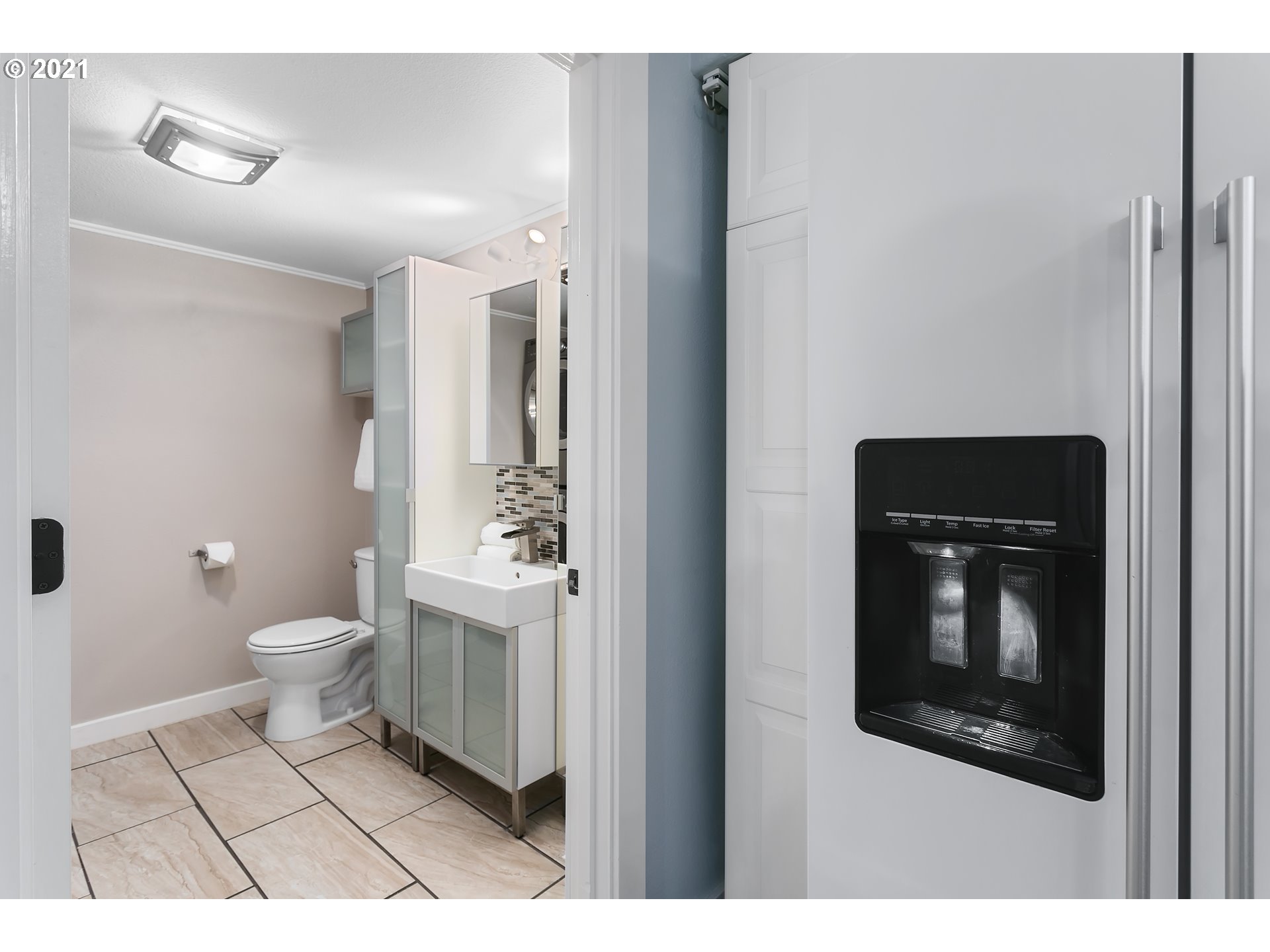 10345 Northeast Clackamas Street, Unit 2 Portland, OR 97220 - Photo 15 of 28 a bathroom with a toilet and a shower