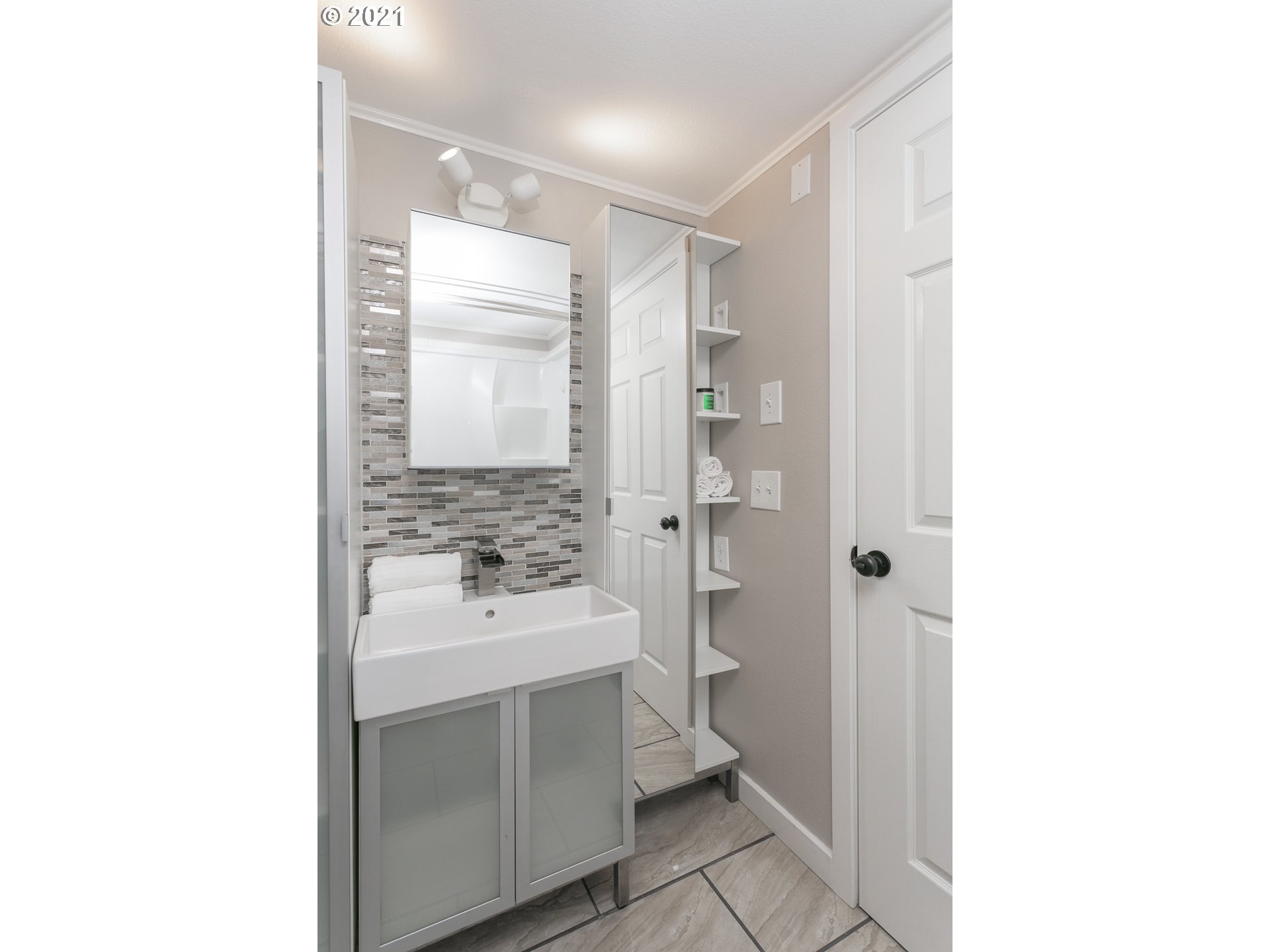 10345 Northeast Clackamas Street, Unit 2 Portland, OR 97220 - Photo 16 of 28 a bathroom with a sink a toilet and shower