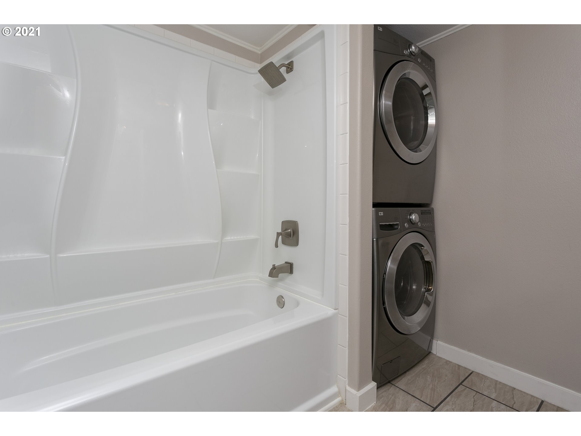 10345 Northeast Clackamas Street, Unit 2 Portland, OR 97220 - Photo 18 of 28 a bathroom with a washing machine and a sink