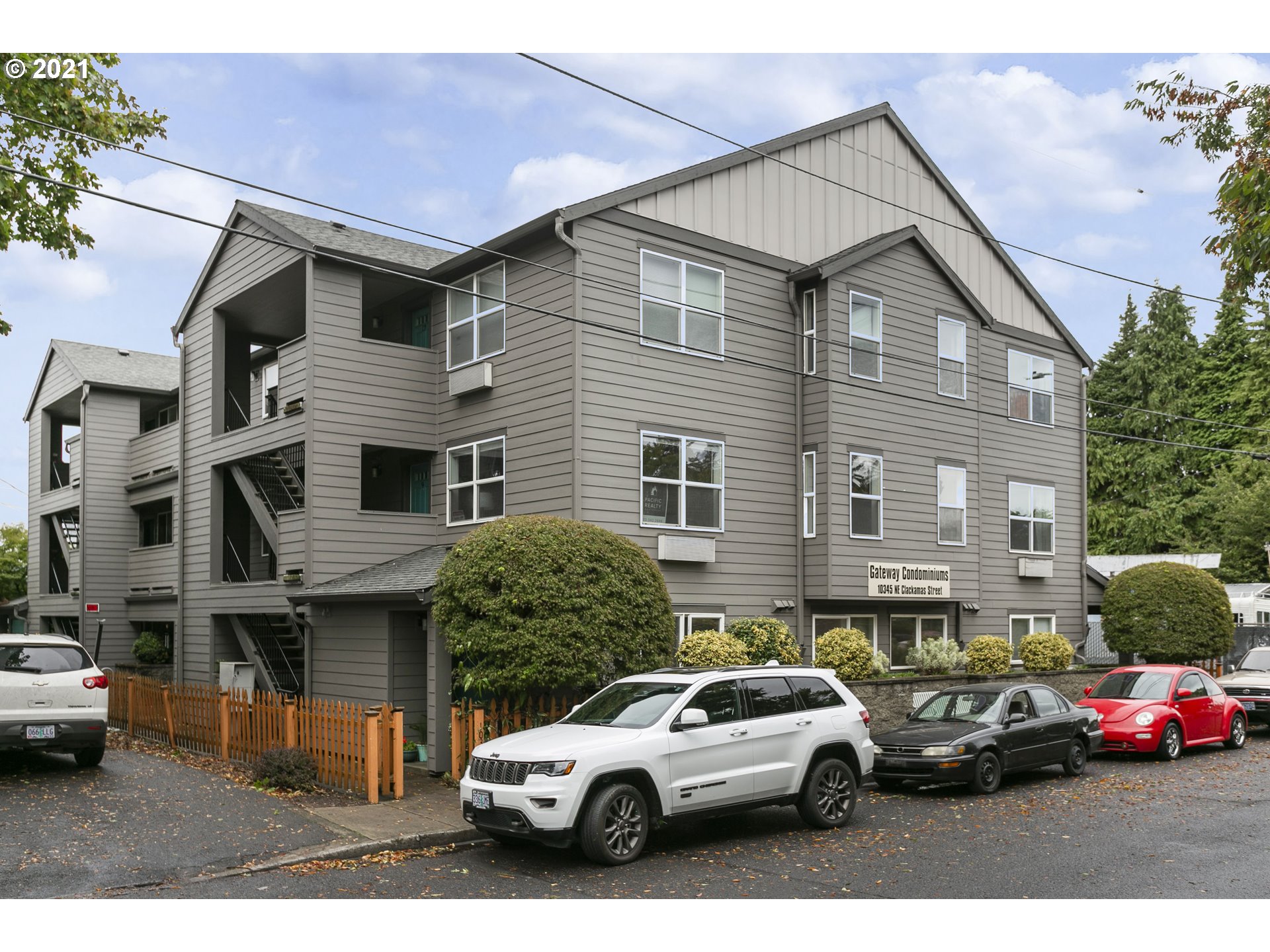 10345 Northeast Clackamas Street, Unit 2 Portland, OR 97220 - Photo 2 of 28 a view of multiple house with a street