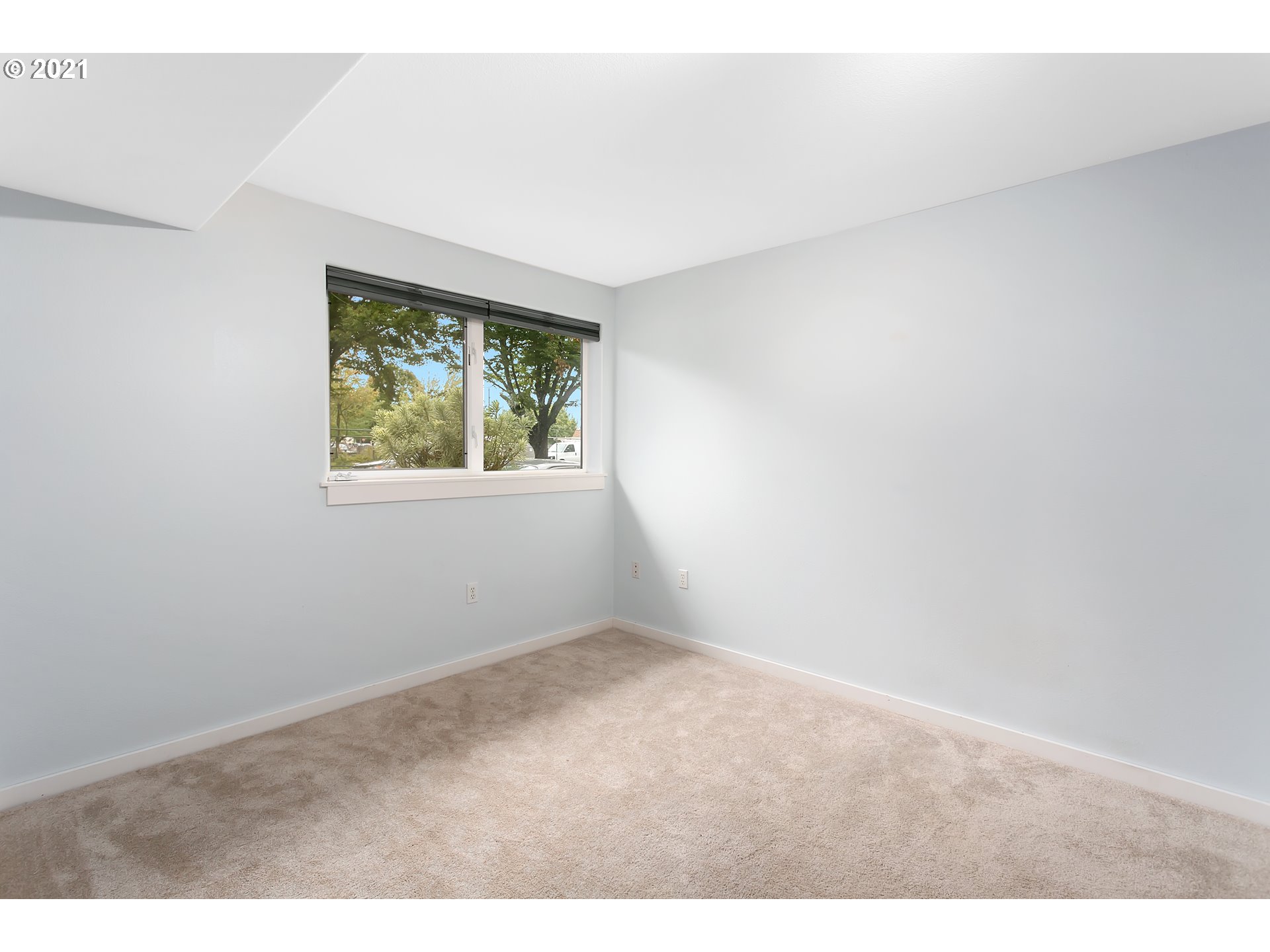 10345 Northeast Clackamas Street, Unit 2 Portland, OR 97220 - Photo 21 of 28 an empty room with windows