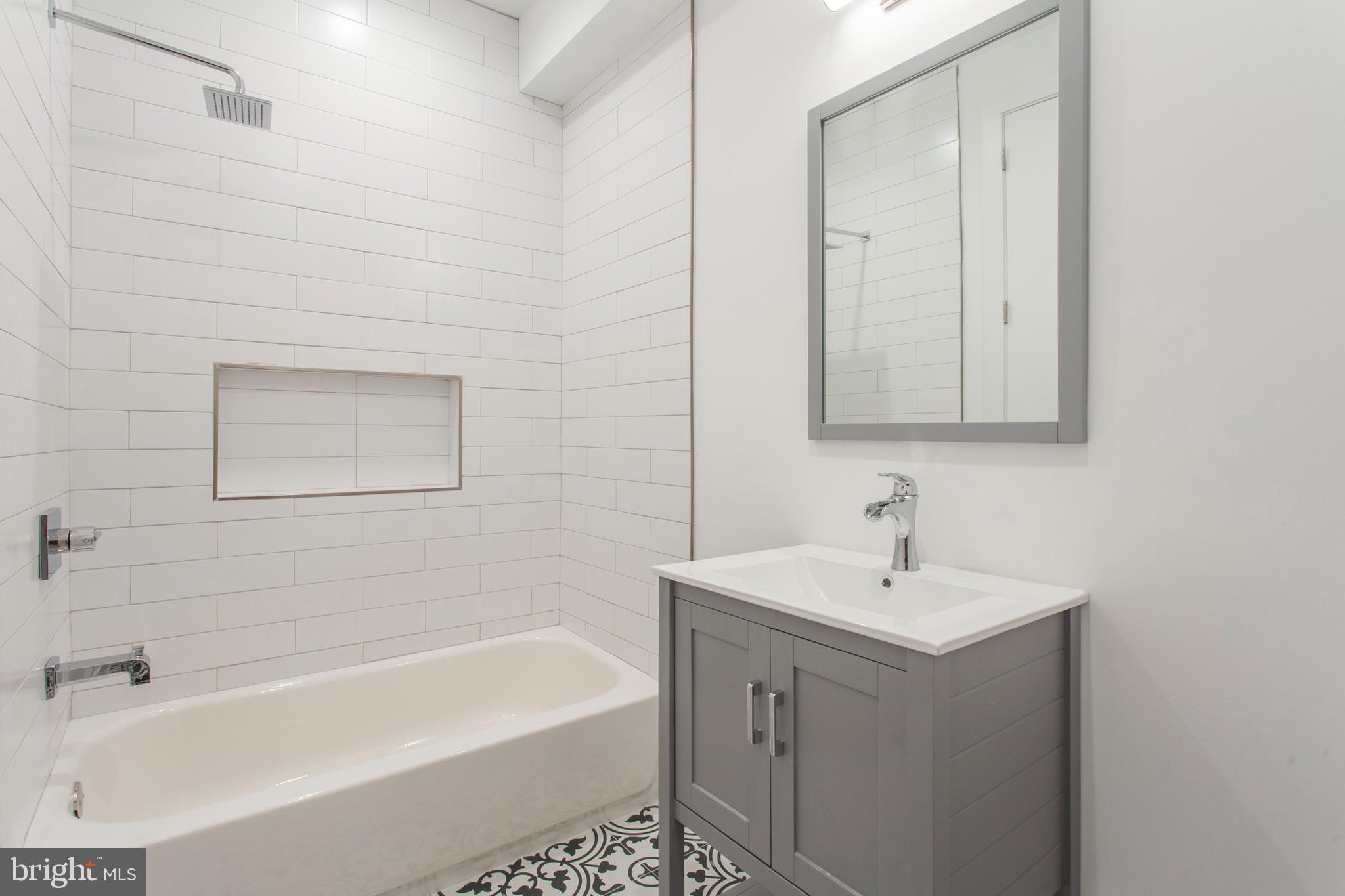 542 Pierce Street Philadelphia, PA 19148 - Photo 17 of 36 a bathroom with a sink and a bathtub