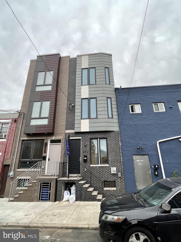 542 Pierce Street Philadelphia, PA 19148 - Photo 2 of 36 a front view of a building with many windows