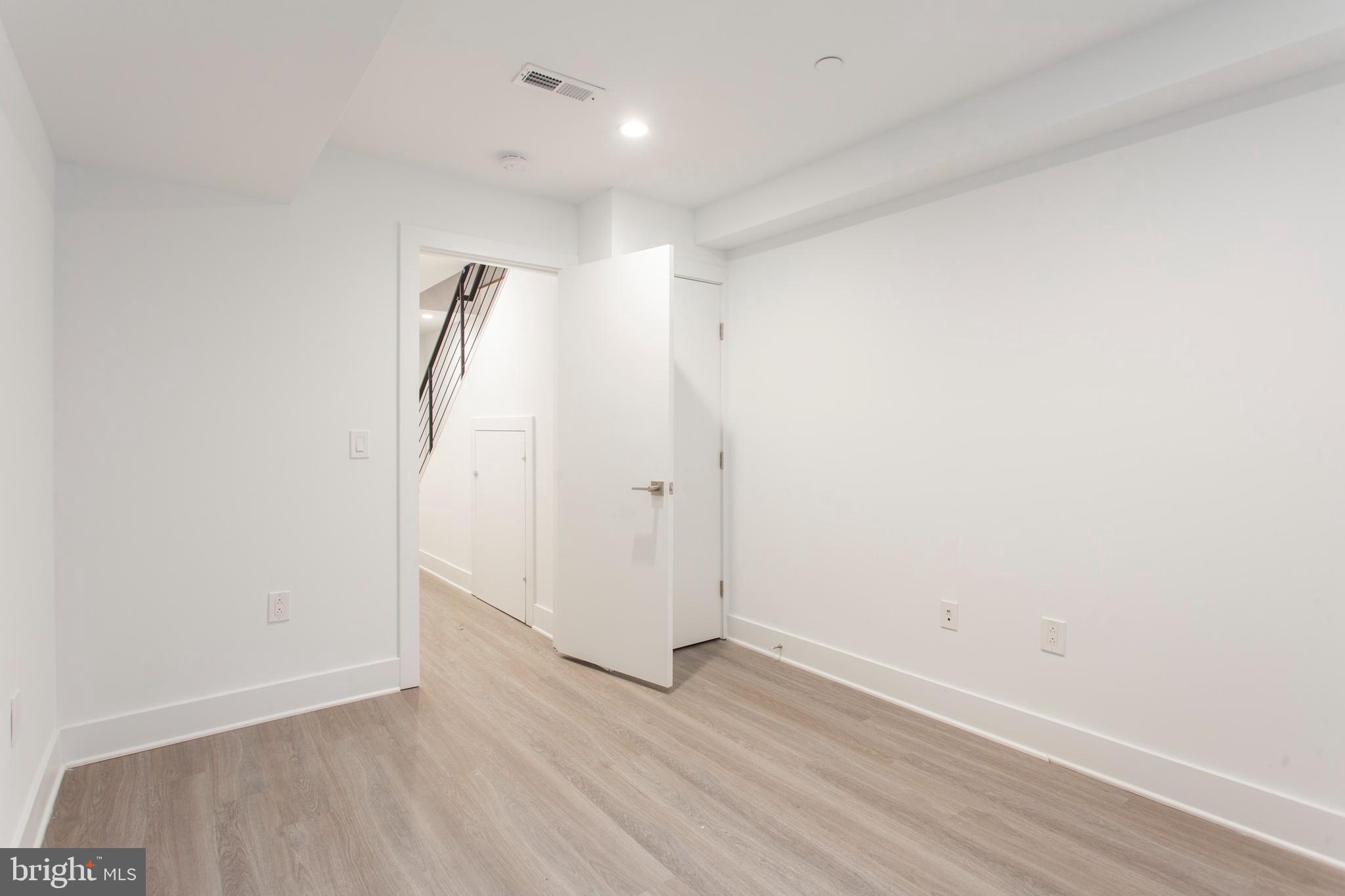542 Pierce Street Philadelphia, PA 19148 - Photo 31 of 36 a view of room with wooden floor