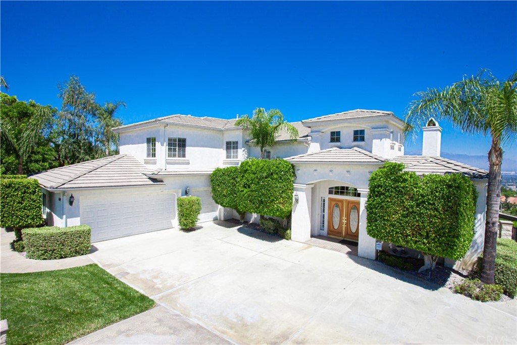 6189 Omega Street Riverside, CA 92506 - Photo 1 of 1 a front view of a house with garden