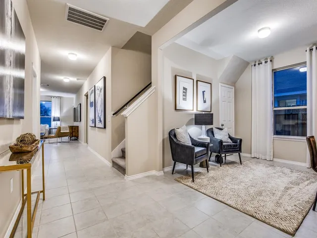 a living room with furniture gym and a window