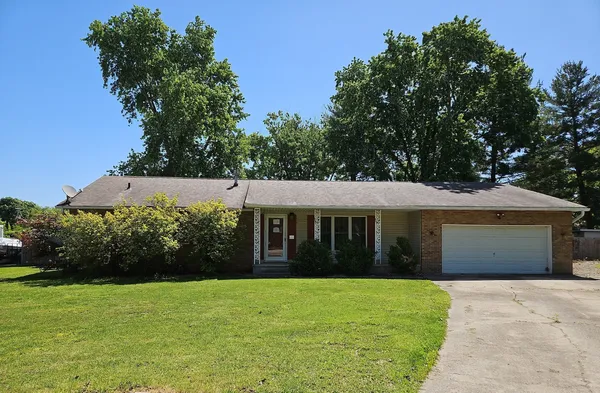 front view of a house with a garden