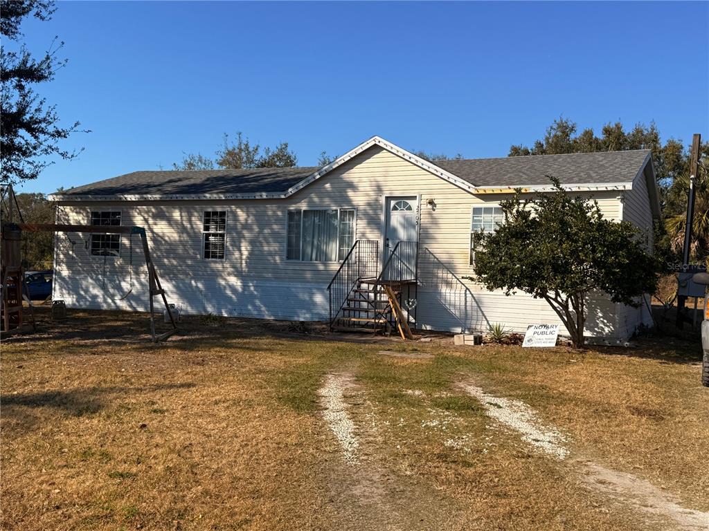 2705 Metro Drive Ruskin, FL 33570 - Photo 1 of 1 a view of a house with a yard