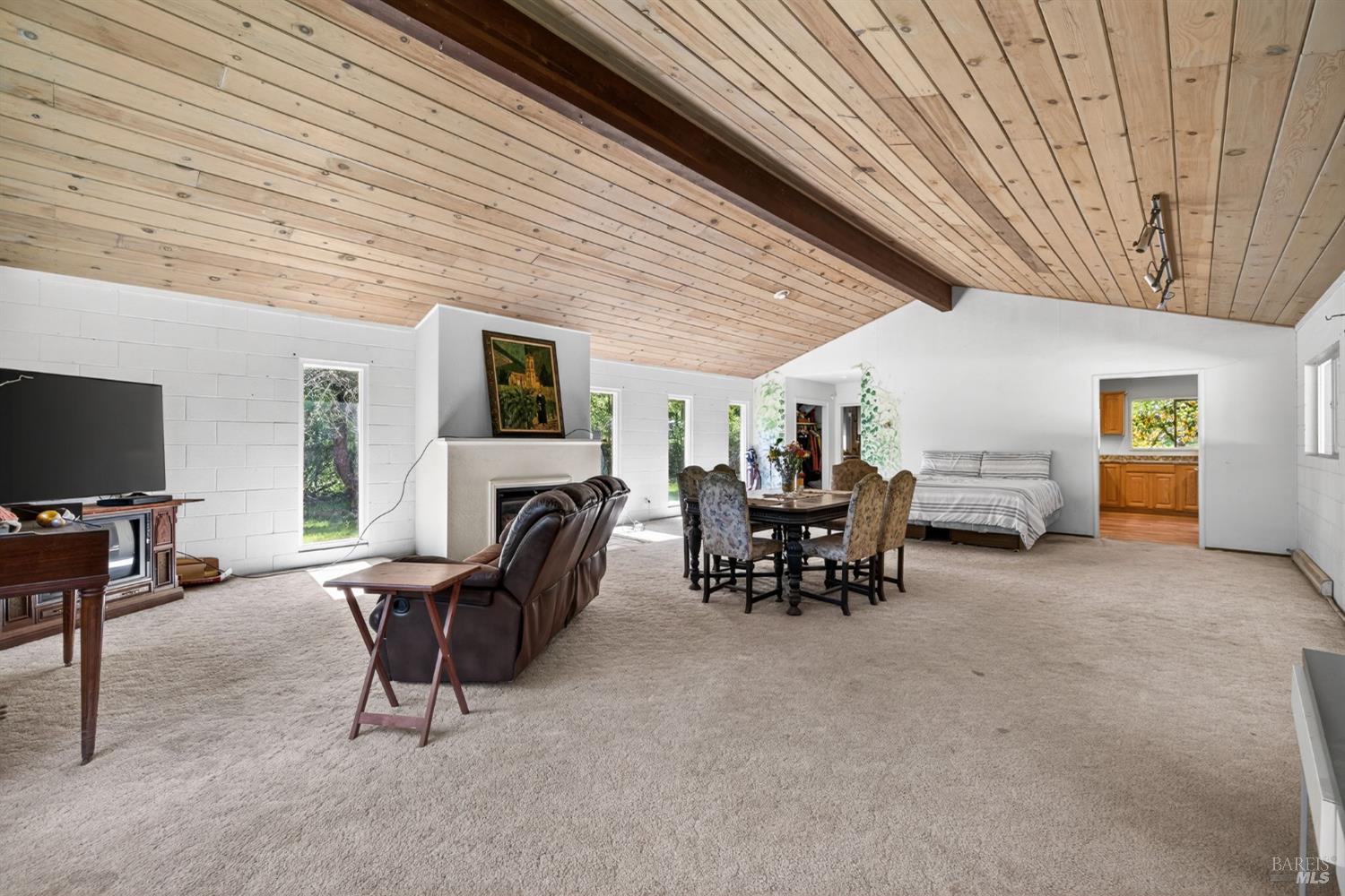 3320 Redwood Road Napa, CA 94558 - Photo 34 of 57 a view of a livingroom with furniture and a flat screen tv