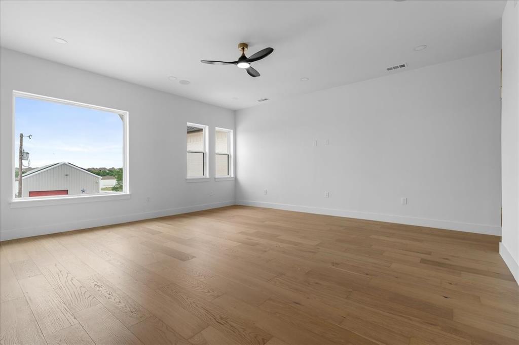 10576 Buccaneer Point Frisco, TX 75036 - Photo 26 of 40 wooden floor in an empty room with a window