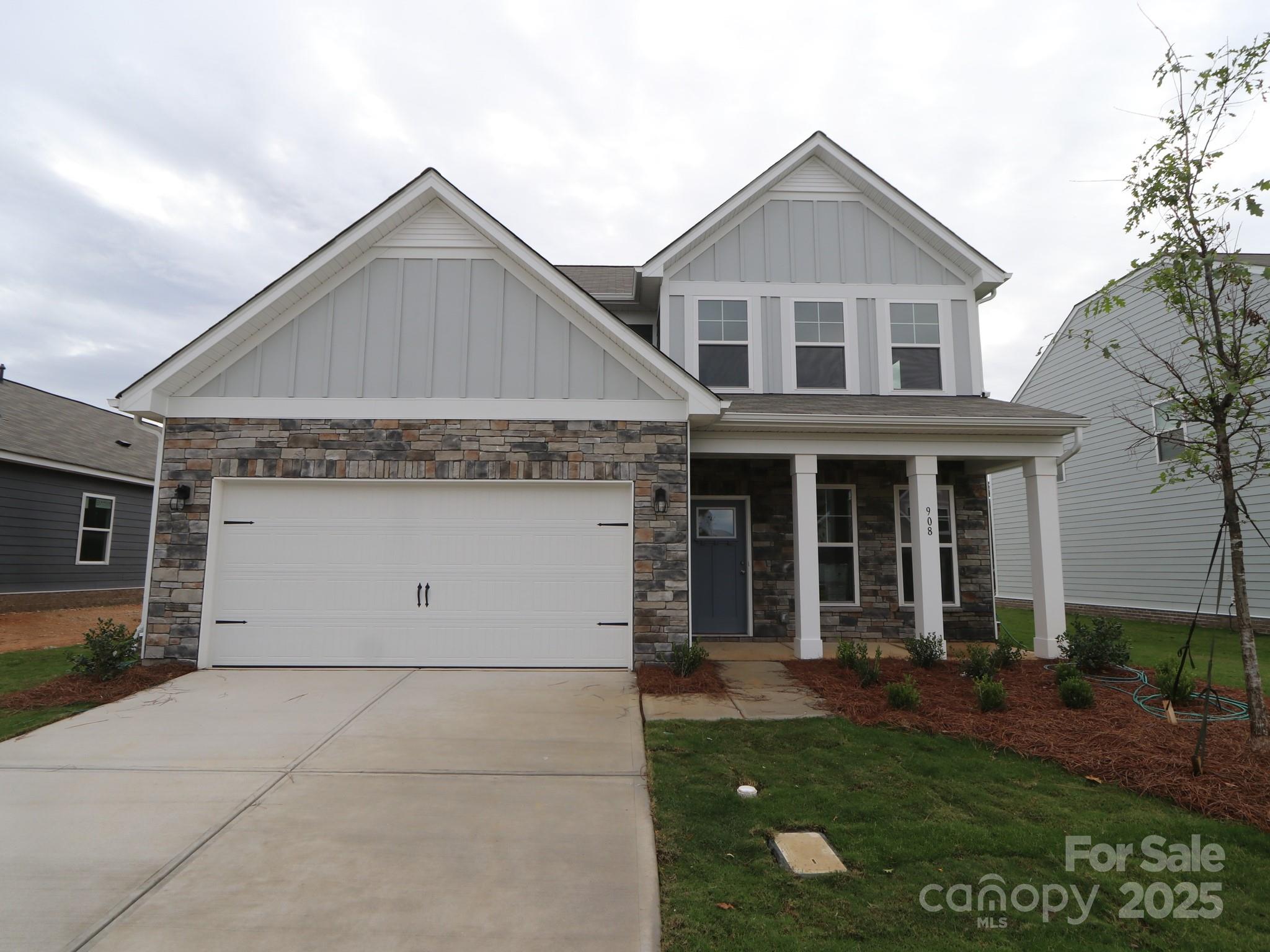 908 Barker Street Monroe, NC 28112 - Photo 1 of 16 a front view of a house with a yard and garage