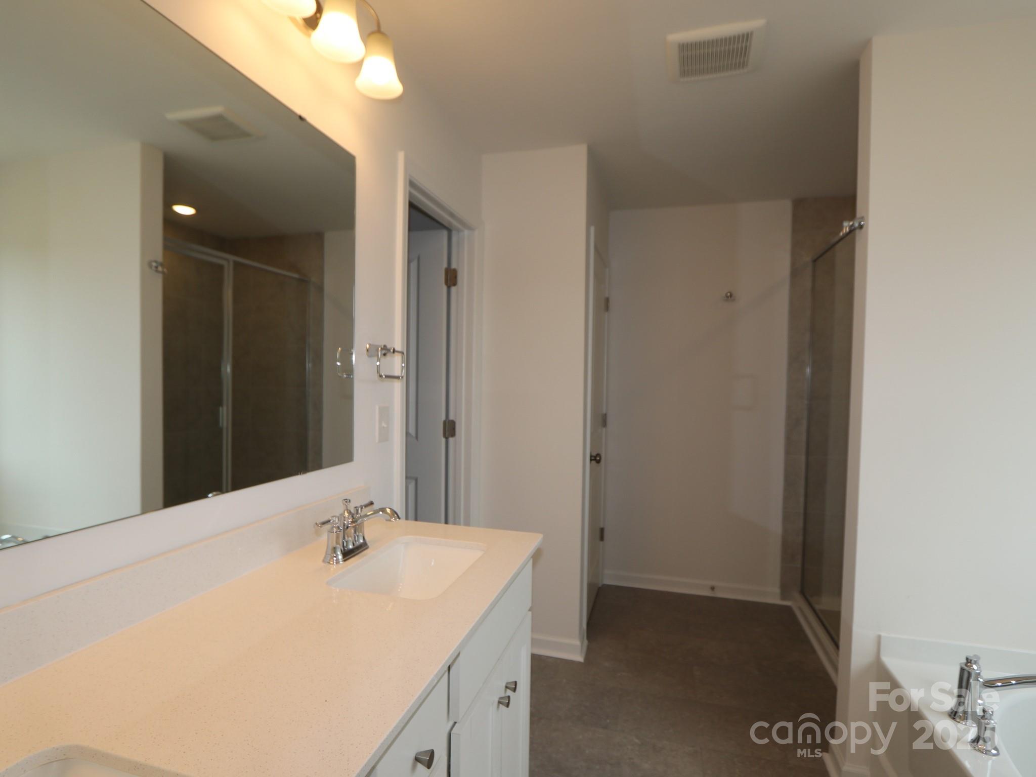 908 Barker Street Monroe, NC 28112 - Photo 16 of 16 a bathroom with a sink and a mirror