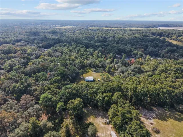 an aerial view of house with yard