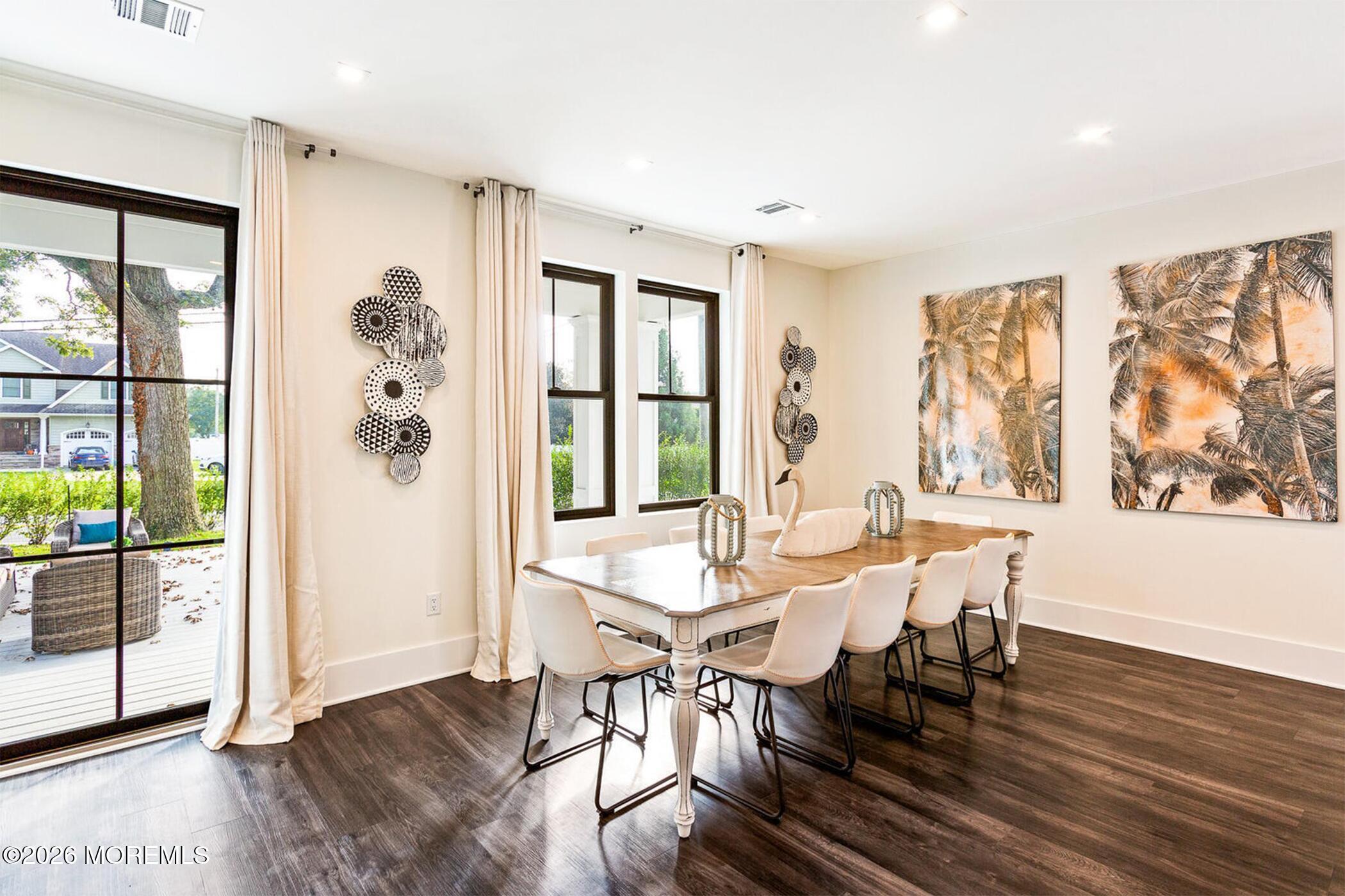 1320 Charles Street Point Pleasant, NJ 08742 - Photo 13 of 41 a view of a dining room with furniture large window and wooden floor