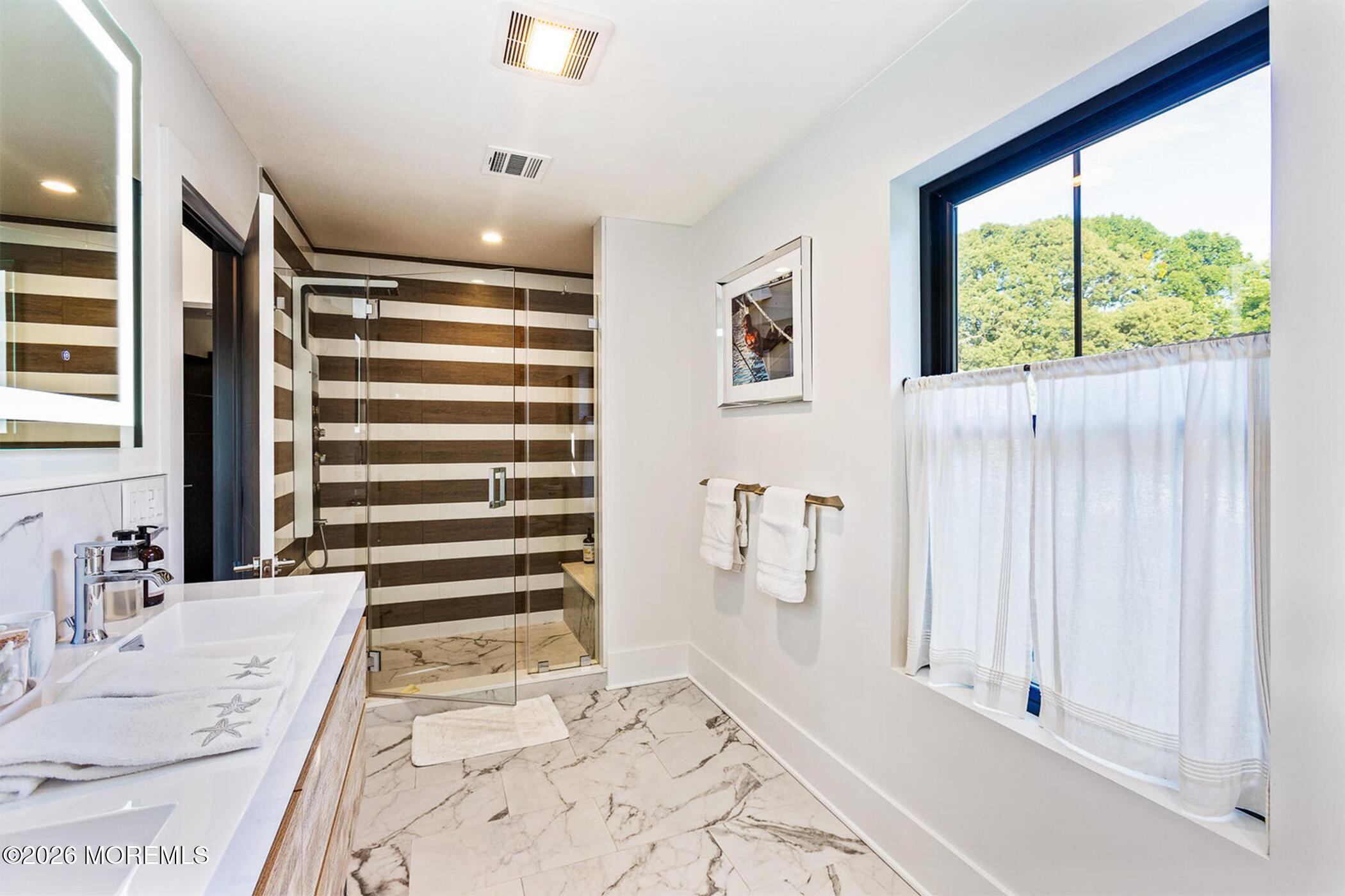 1320 Charles Street Point Pleasant, NJ 08742 - Photo 22 of 41 a view of a bedroom with a bed and a window