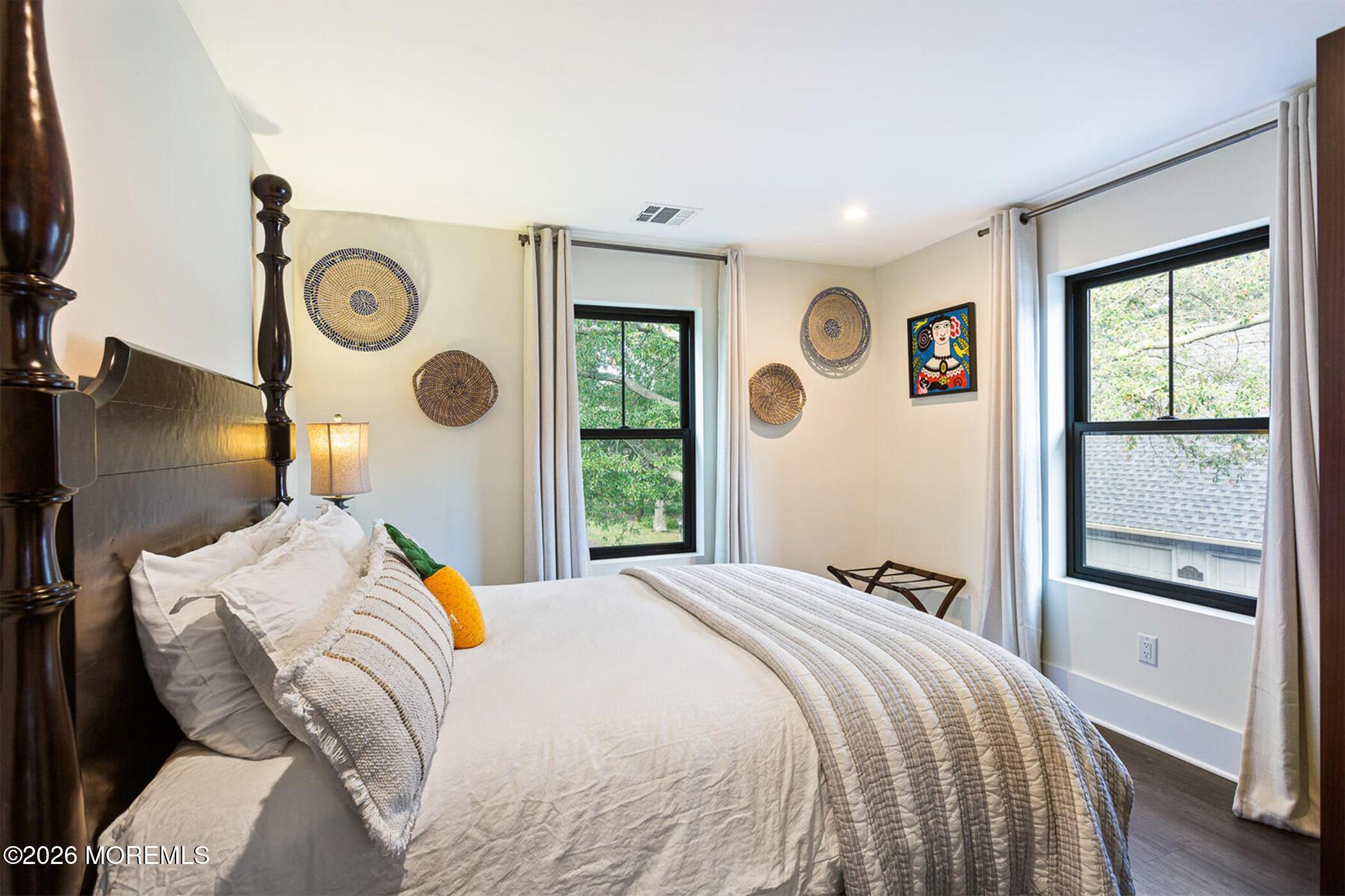 1320 Charles Street Point Pleasant, NJ 08742 - Photo 28 of 41 a bedroom with a bed and a window