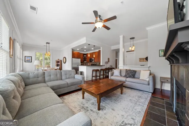 a living room with furniture and a fireplace