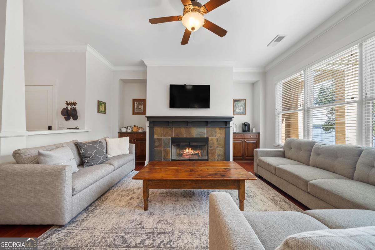 129 South Bay Road Eatonton, GA 31024 - Photo 12 of 45 a living room with furniture and a fireplace