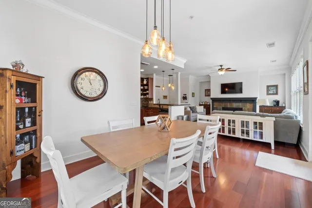 a kitchen with granite countertop a sink stove and microwave