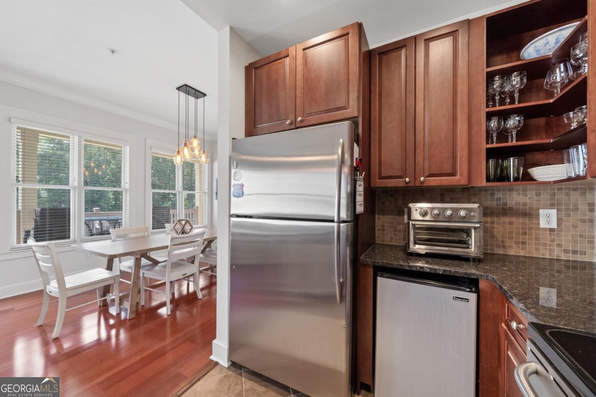 129 South Bay Road Eatonton, GA 31024 - Photo 20 of 45 a kitchen with stainless steel appliances granite countertop a refrigerator and a stove top oven