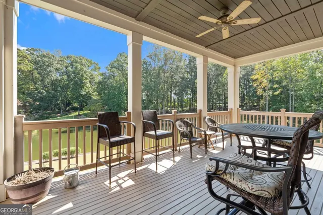 a view of balcony with wooden floor and outdoor seating