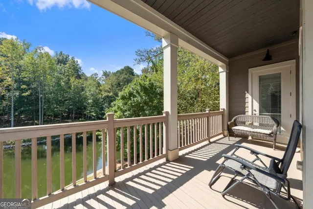 a view of a chairs and table on the deck