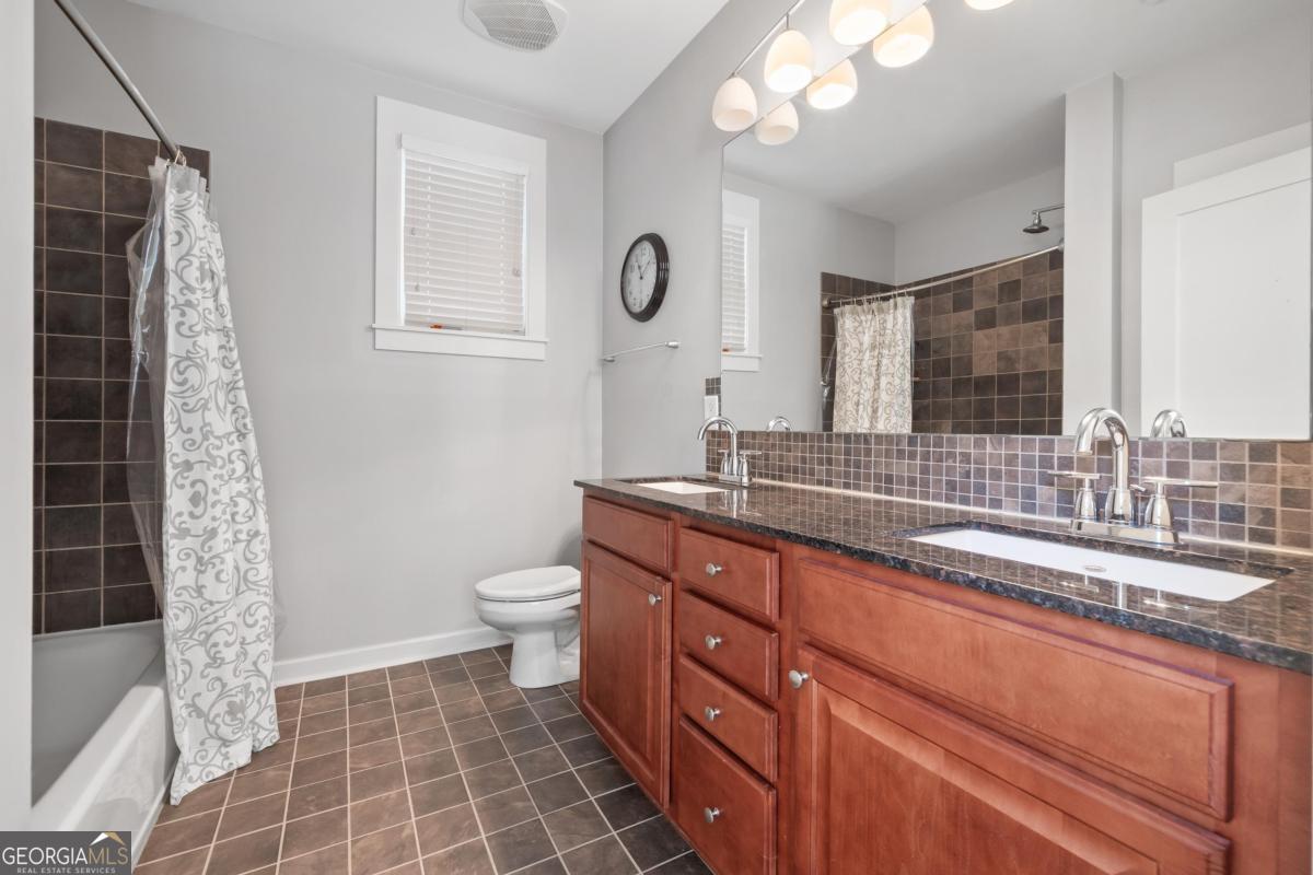 129 South Bay Road Eatonton, GA 31024 - Photo 33 of 45 a bathroom with a double vanity sink and a mirror