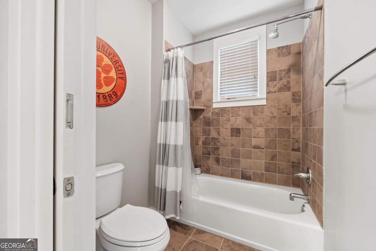 129 South Bay Road Eatonton, GA 31024 - Photo 37 of 45 a bathroom with a toilet and a bathtub