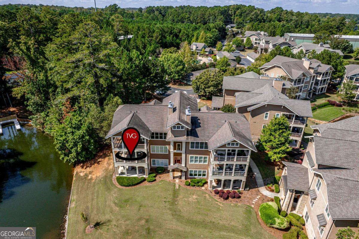 129 South Bay Road Eatonton, GA 31024 - Photo 4 of 45 an aerial view of a house with swimming pool and lake view