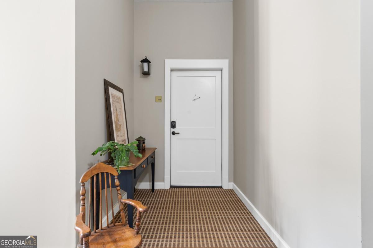 129 South Bay Road Eatonton, GA 31024 - Photo 6 of 45 a view of a hallway and a potted plant