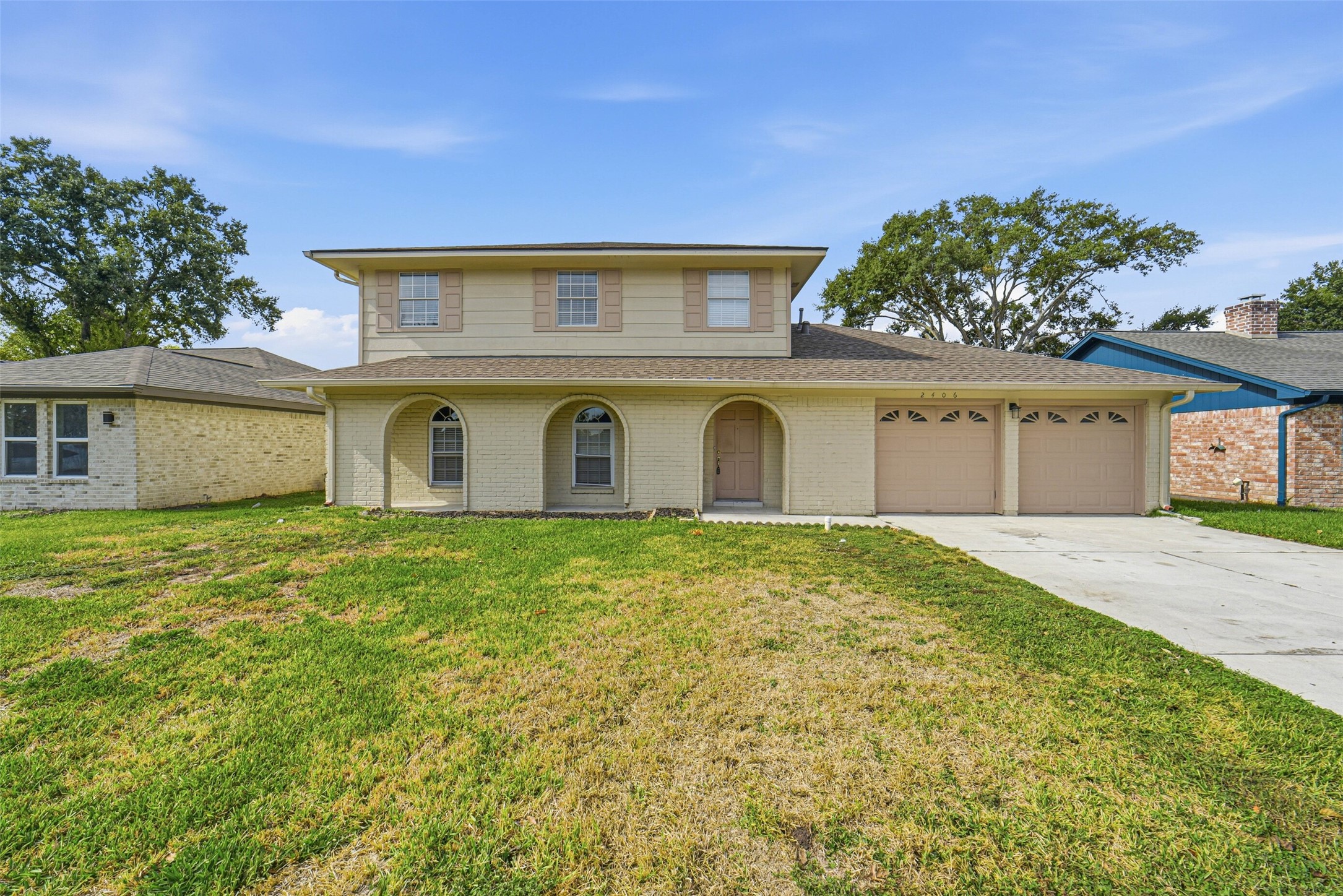 2406 Joel Wheaton Road Houston, TX 77077 - Photo 1 of 36 a front view of a house with a garden