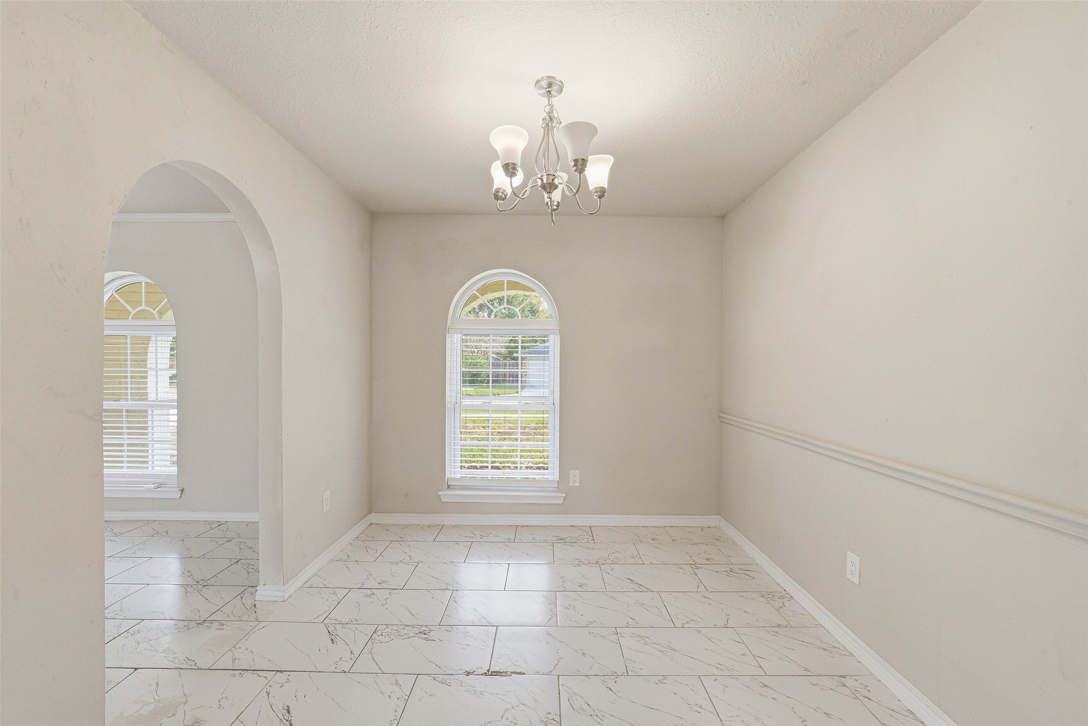 2406 Joel Wheaton Road Houston, TX 77077 - Photo 20 of 36 an empty room with windows
