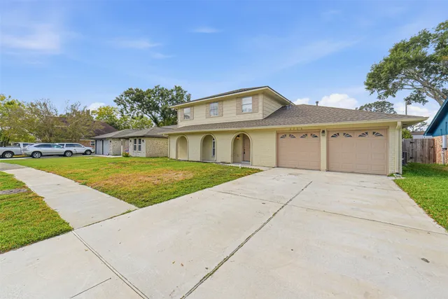 a house with garden in front of it