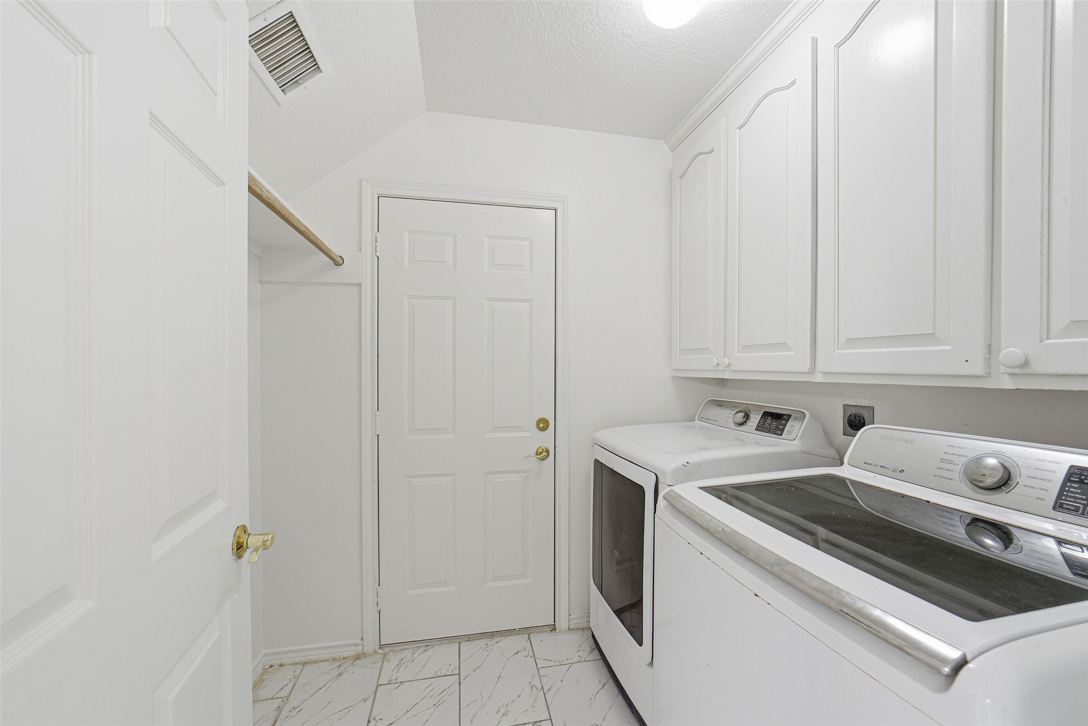 2406 Joel Wheaton Road Houston, TX 77077 - Photo 22 of 36 a utility room with dryer and washer