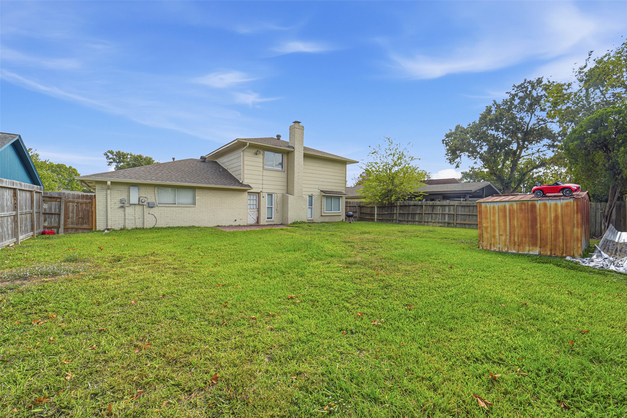 2406 Joel Wheaton Road Houston, TX 77077 - Photo 35 of 36 a view of a house with yard and a garden