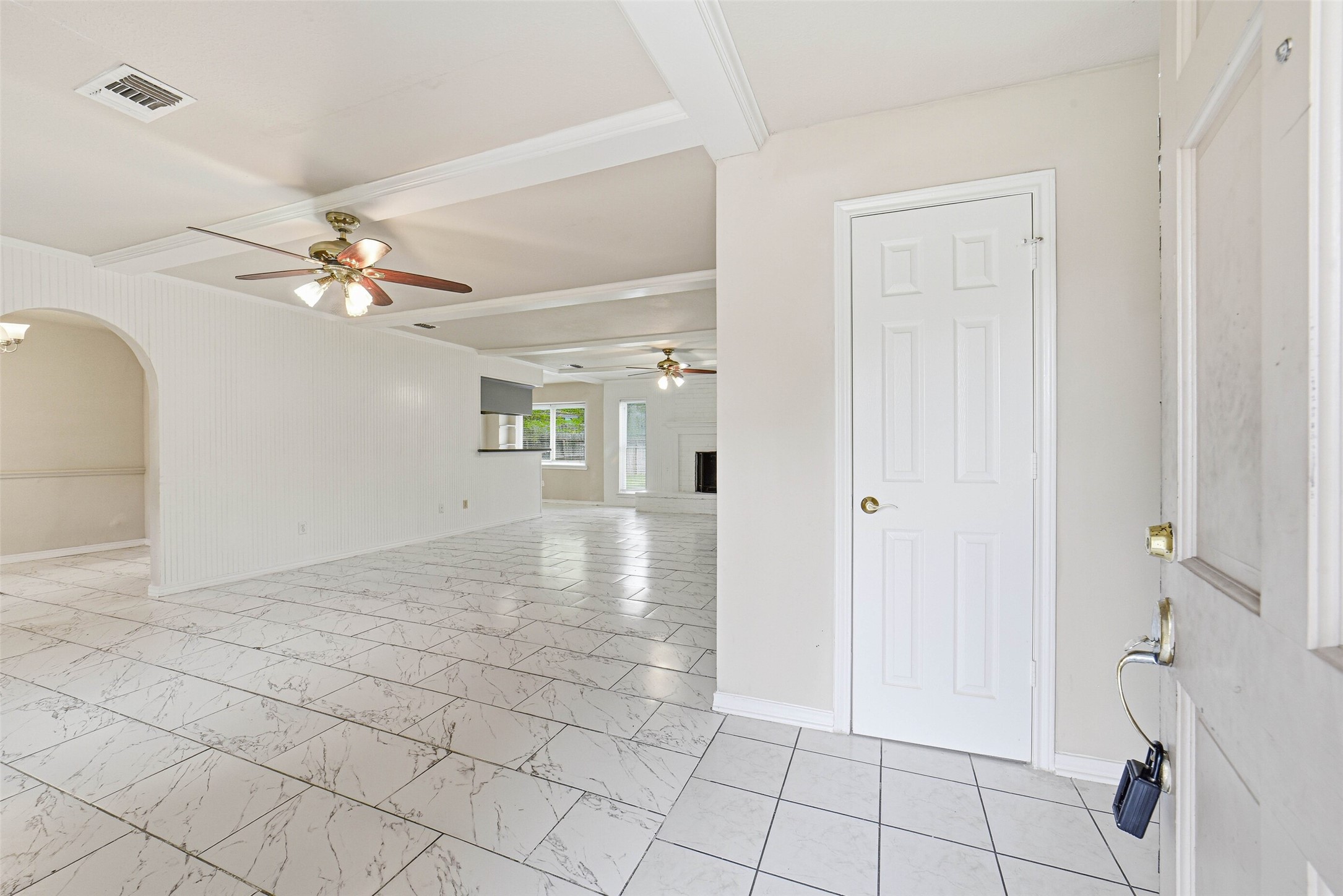 2406 Joel Wheaton Road Houston, TX 77077 - Photo 5 of 36 a view of an empty room and chandelier fan