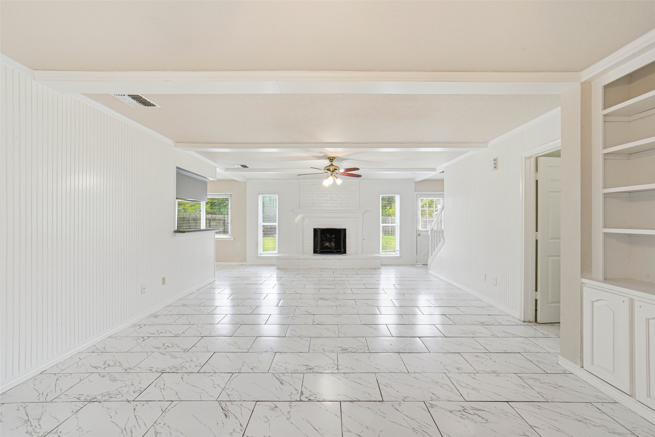 2406 Joel Wheaton Road Houston, TX 77077 - Photo 6 of 36 wooden floor in an empty room with a fireplace