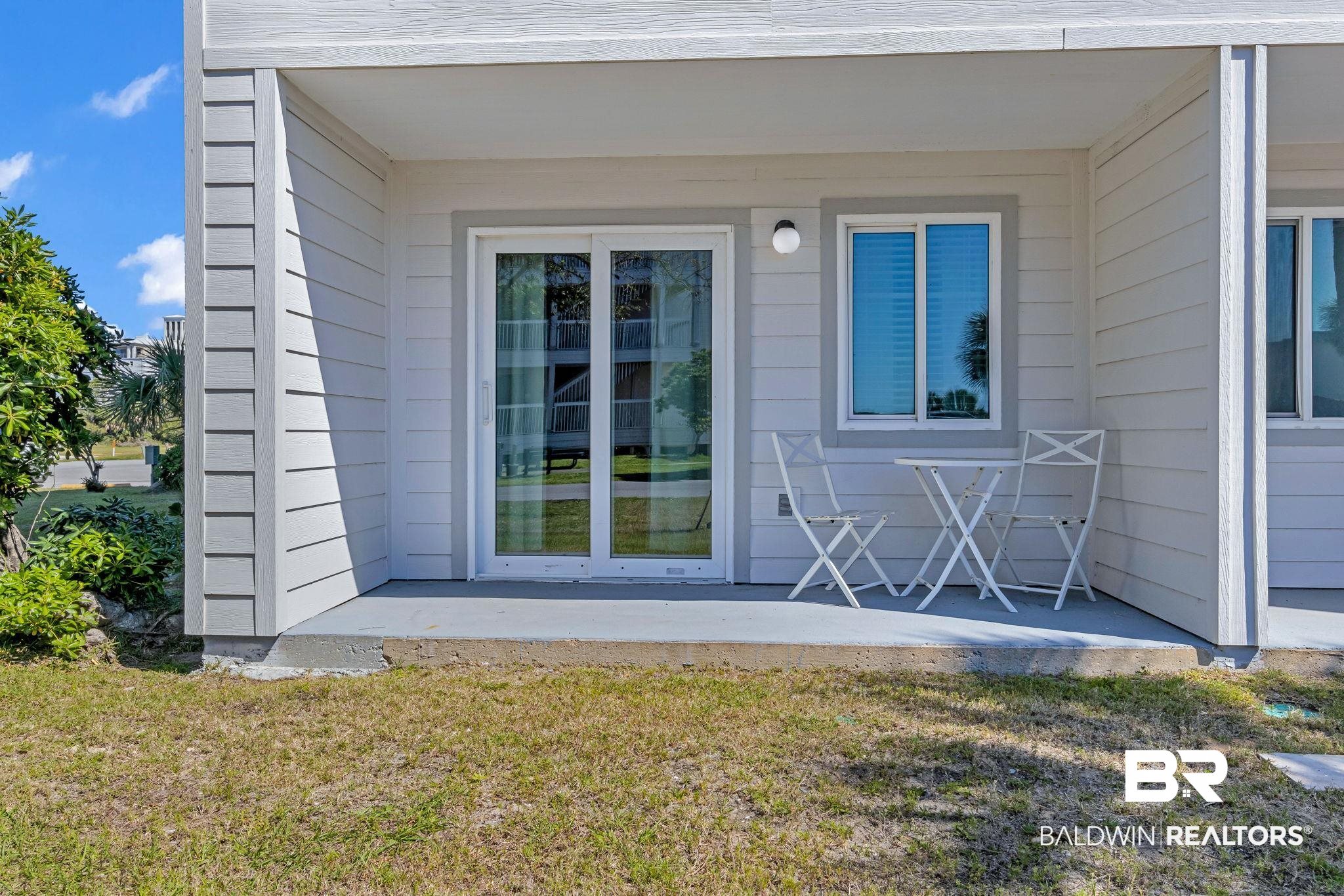 400 Plantation Road, Unit 4115 Gulf Shores, AL 36542 - Photo 25 of 48 Doorway to property featuring a lawn