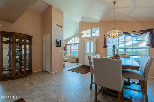 a kitchen with stainless steel appliances granite countertop a sink a stove and refrigerator