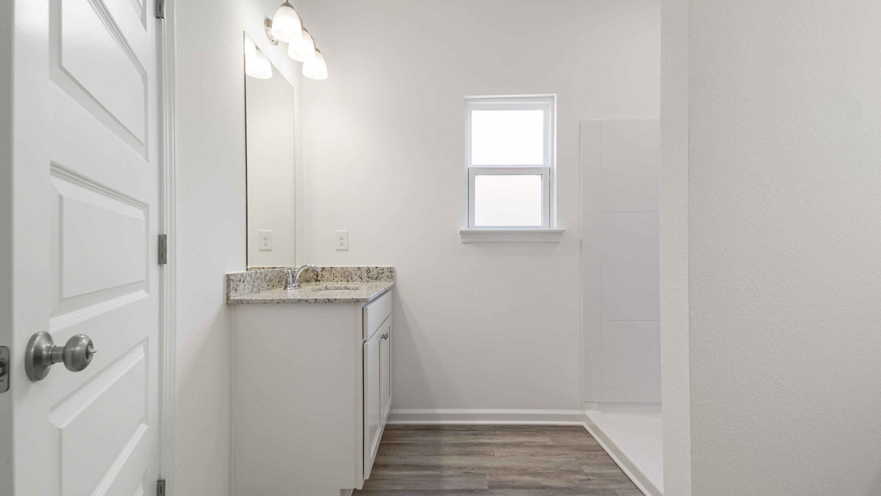 216 Huckleberry Street Freeport, FL 32439 - Photo 22 of 32 a bathroom with a sink and vanity