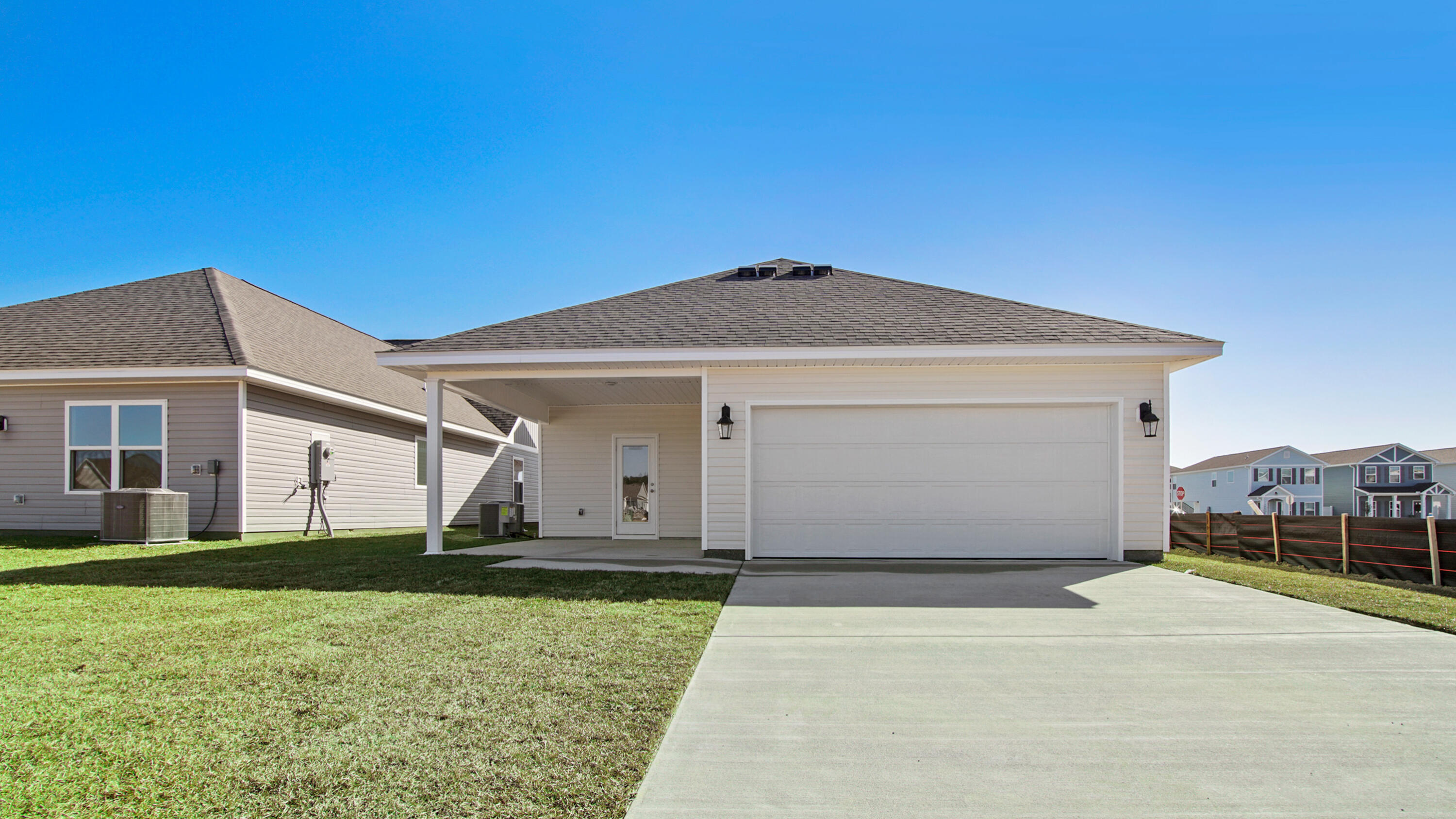 216 Huckleberry Street Freeport, FL 32439 - Photo 31 of 32 a front view of a house with a yard