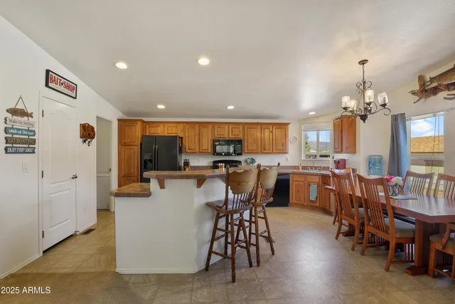 a view of a dining area with furniture and chandelier