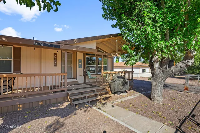 a view of backyard with a patio and outdoor seating